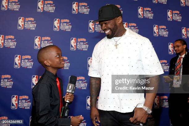 Jeremiah Fennell and 50 Cent attend the 2024 Ruffles NBA All-Star Celebrity Game at Lucas Oil Stadium on February 16, 2024 in Indianapolis, Indiana.