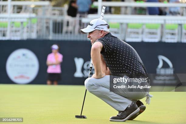 Rob Labritz of the United States lines up a putt on the 18th green during the first round of the Chubb Classic at Tiburon Golf Club on February 16,...
