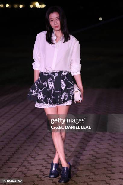 South Korean actor and model Wang Ji-hyun arrives to attend the catwalk presentation for British fashion house Burberry's Autumn/Winter 2024...
