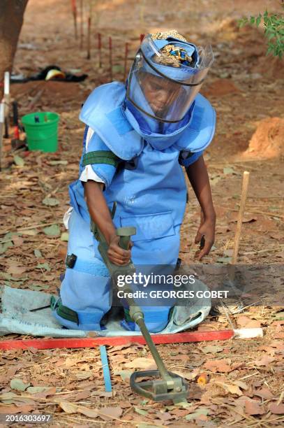 Elisabeth from Zinguinchor, the capital of the southern Senegalese region of Casamance, and one of the only two women deminers in Sengal works on May...