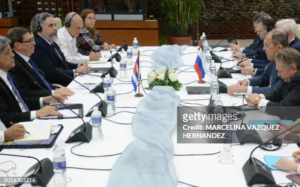 Picture released by Cuban News Agency showing Cuban Foreign Minister Bruno Rodriguez and his Russian counterpart Sergei Lavrov holding a meeting with...