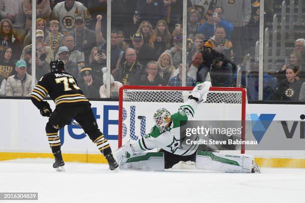 Charlie McAvoy of the Boston Bruins scores in a shootout against Jake Oettinger of the Dallas Stars at the TD Garden on February 19, 2024 in Boston,...