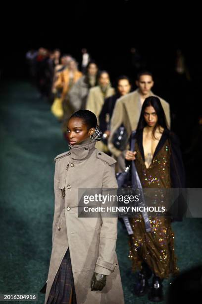 Models present creations during a catwalk presentation for British fashion house Burberry's Autumn/Winter 2024 collection, at London Fashion Week in...