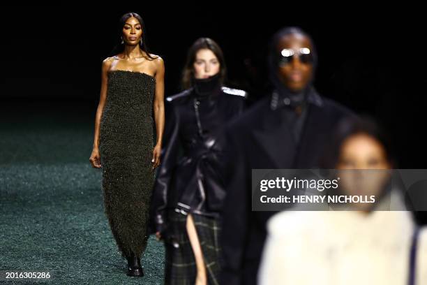 British model Naomi Campbell presents a creation during a catwalk presentation for British fashion house Burberry's Autumn/Winter 2024 collection, at...