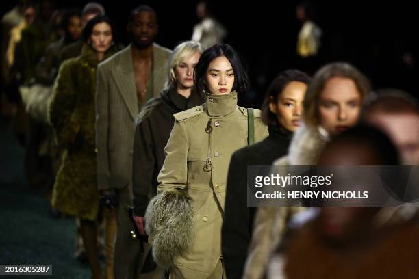 Models present creations during a catwalk presentation for British fashion house Burberry's Autumn/Winter 2024 collection, at London Fashion Week in...