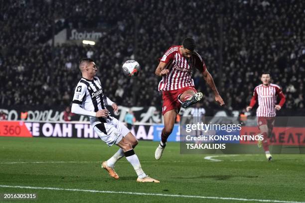 Portuguese defender David Carmo of Olympiacos clears the ball in front of the Bulgarian forward Kiril Despodov of PAOK during the football match PAOK...