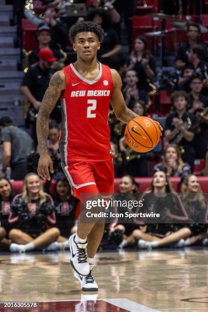 New Mexico guard Donovan Dent dribbles in the first half of a college basketball game between the New Mexico Lobos and the San Diego State Aztecs on...