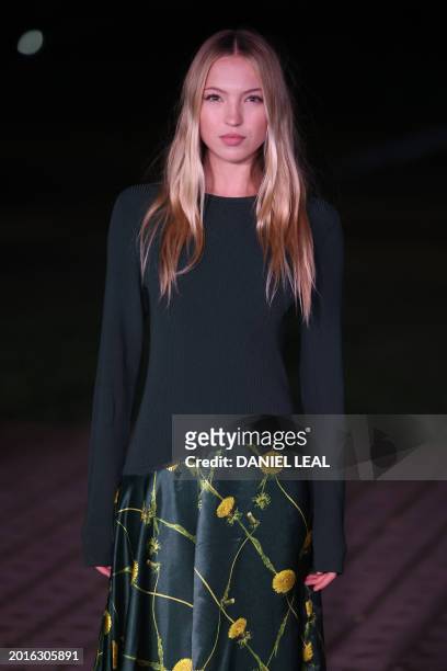 British model Lila Moss arrives to attend the catwalk presentation for British fashion house Burberry's Autumn/Winter 2024 collection, at London...