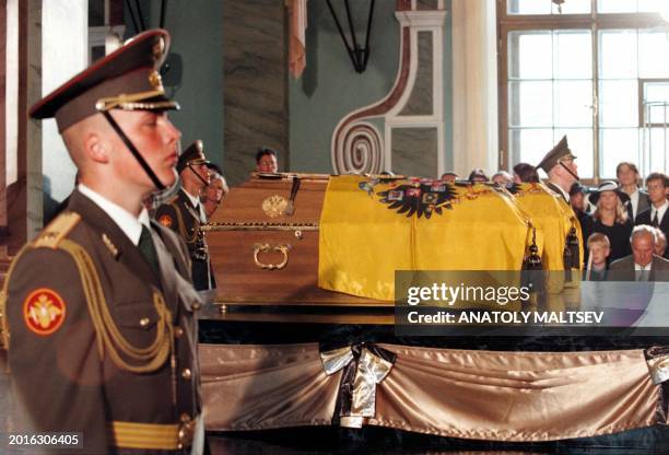 An honour guard stands at the coffins with the remains of the last Russian Tzar Nicholas II and his wife Alexandra as members of the Romanov family...