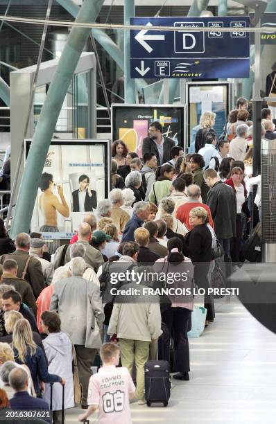 Passengers of Eurostar bound to London get ready to embark at Lille station, north of France, 07 July 2005. French train operator SNCF warned his...