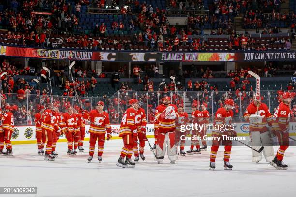 The Calgary Flames celebrate on ice after a win against the Winnipeg Jets at Scotiabank Saddledome on February 19, 2024 in Calgary, Alberta, Canada.