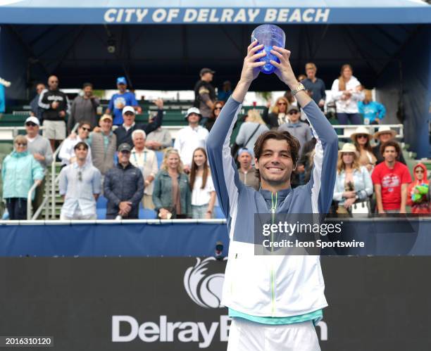 Taylor Fritz poses with the Champions Trophy after winning the 2024 Delray Beach Open on February 19 at the Delray Beach Tennis Center in Delray...