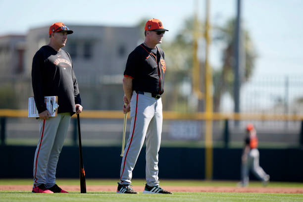Pitching coach Bryan Price and manager Bob Melvin of the San Francisco Giants watch live batting practice during the San Francisco Giants Spring...