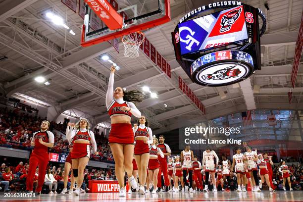 Cheerleaders of the NC State Wolfpack perform during the game against the Georgia Tech Yellow Jackets at Reynolds Coliseum on February 18, 2024 in...