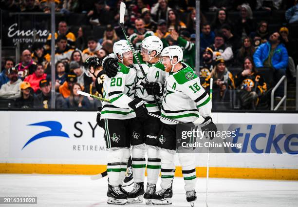 Ryan Suter of the Dallas Stars celebrates his second-period goal with Joe Pavelski and Roope Hintz against the Boston Bruins at TD Garden at TD...