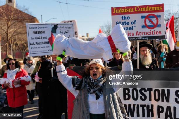 People, holding banners, attend the 'Hands off Rafah' Emergency protests against the new phase of the Gaza genocide organized by Massachusetts Peace...