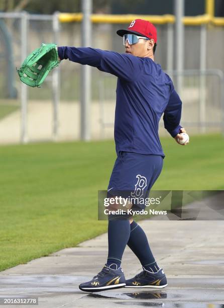 Masataka Yoshida plays catch at spring training with the Boston Red Sox on Feb. 19 in Fort Myers, Florida.