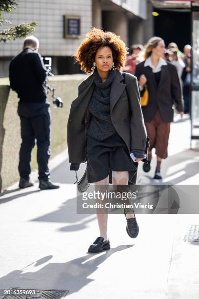 Guest wears grey blazer outside Edward Crutchley during London Fashion Week February 2024 on February 16, 2024 in London, England.
