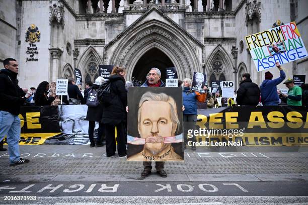 Artist Kaya Mar displays a painting as supporters of WikiLeaks founder Julian Assange gather outside the Royal Courts of Justice on February 20, 2024...