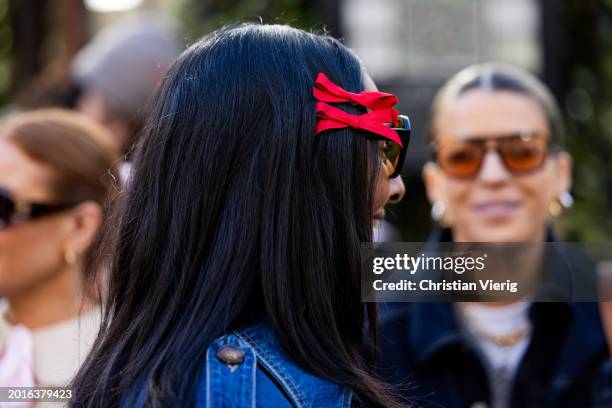 Zeena Shah wears sunglasses, red hair accessoires outside Bora Aksu during London Fashion Week February 2024 on February 16, 2024 in London, England.