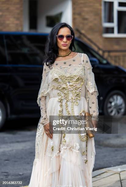 Anoushka Shankar wears white laced dress, metallic bag outside Bora Aksu during London Fashion Week February 2024 on February 16, 2024 in London,...