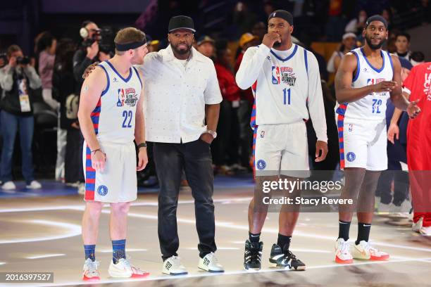 Conor Daly of Team Shannon, Team Shannon Coach 50 Cent, Micah Parsons of Team Shannon and Quincy Isaiah of Team Shannon look on before the game...