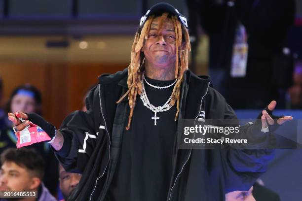 Team Stephen A. Coach Lil Wayne poses for a photo during the first half against Team Shannon during the Ruffles NBA All-Star Celebrity Game at Lucas...