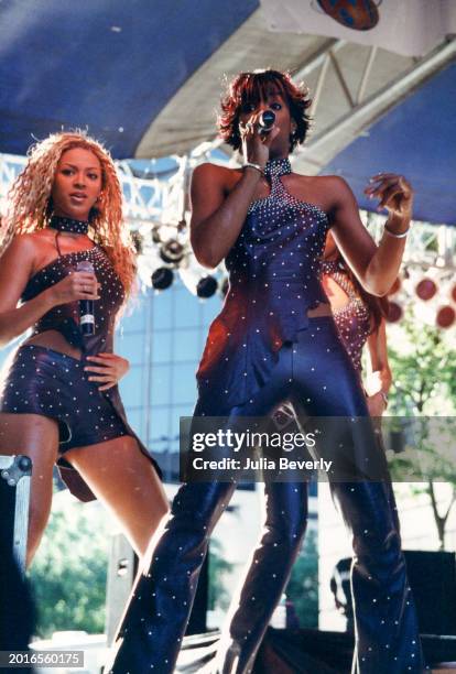 Singers Beyoncé Knowles, Kelly Rowland, & Michelle Williams of Destiny's Child perform in Orlando, Florida, on April 1, 2001.