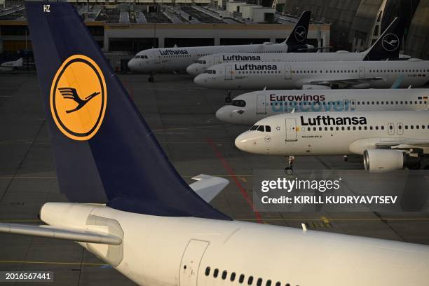 Planes of German airline Lufthansa and Lufthansa subsidiary Eurowings are seen parked on the tarmac at Frankfurt Airport, Frankfurt am Main, western...