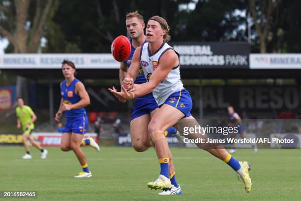Harley Reid of the Eagles handballs away during the West Coast Eagles AFL Intra Club match at Mineral Resources Park on February 17, 2024 in Perth,...