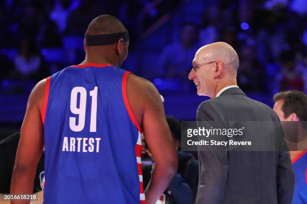Commissioner Adam Silver talks with Metta World Peace of Team Stephen A. During the second half during the Ruffles NBA All-Star Celebrity Game at...