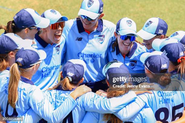 Breakers huddle ahead of fielding during the WNCL match between New South Wales and South Australia at Cricket Central, on February 17 in Sydney,...