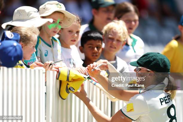 Ellyse Perry of Australia signs autographs on the boundary during day three of the Women's Test Match between Australia and South Africa at WACA on...