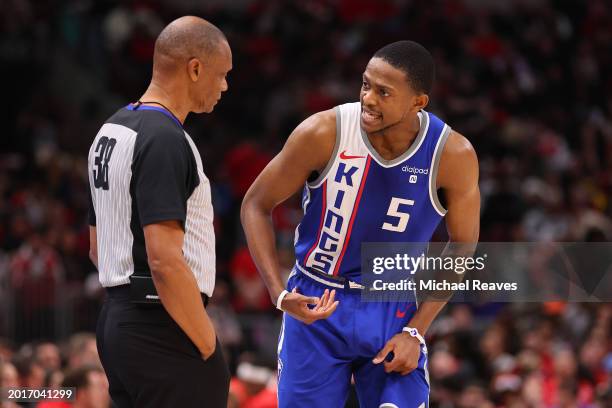 De'Aaron Fox of the Sacramento Kings talks with referee Michael Smith against the Chicago Bulls during the second half at the United Center on...