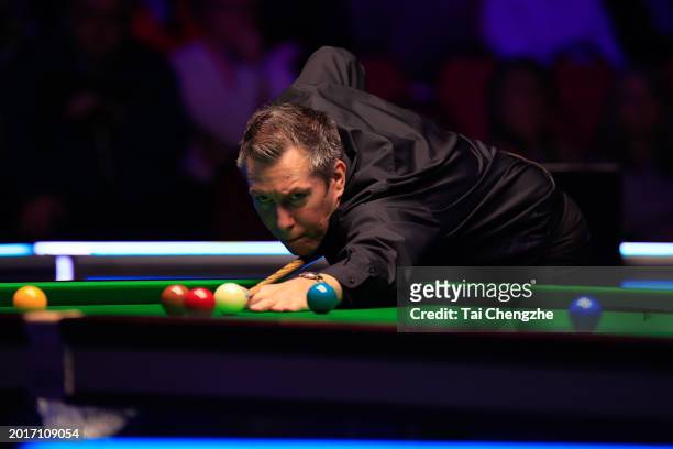 Dominic Dale of Wales plays a shot in the Quarterfinal match against Elliot Slessor of England on day five of 2024 Betvictor Welsh Open at Venue...