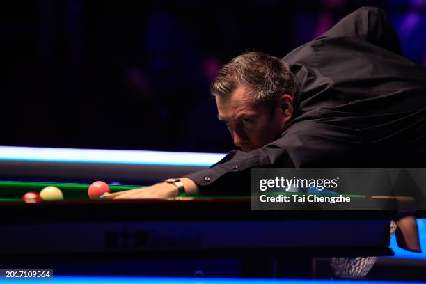 Dominic Dale of Wales plays a shot in the Quarterfinal match against Elliot Slessor of England on day five of 2024 Betvictor Welsh Open at Venue...