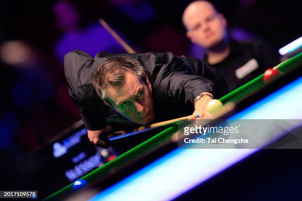 Dominic Dale of Wales plays a shot in the Quarterfinal match against Elliot Slessor of England on day five of 2024 Betvictor Welsh Open at Venue...