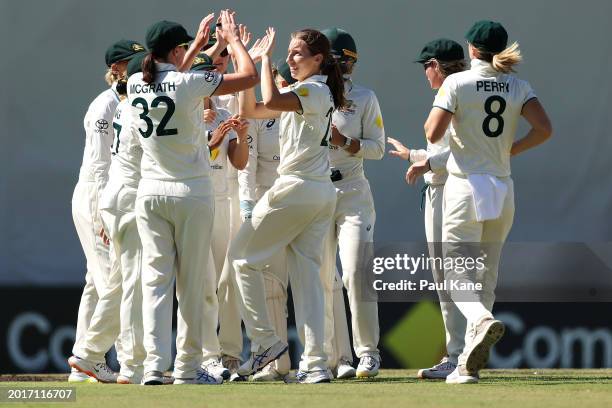 Darcy Brown of Australia celebrates with her team after taking the wicket of Sinalo Jafta of South Africa during day three of the Women's Test Match...