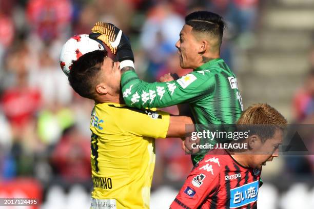 Cristiano of Kashiwa Reysol and Gu Sung-yun of Consadole Sapporo collide during the J.League J1 match between Hokkaido Consadole Sapporo and Kashiwa...