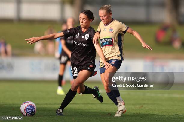 Alicia Woods of the Roar competes for the ball with Elizabeth Copus-Brown of the Jets during the A-League Women round 17 match between Newcastle Jets...