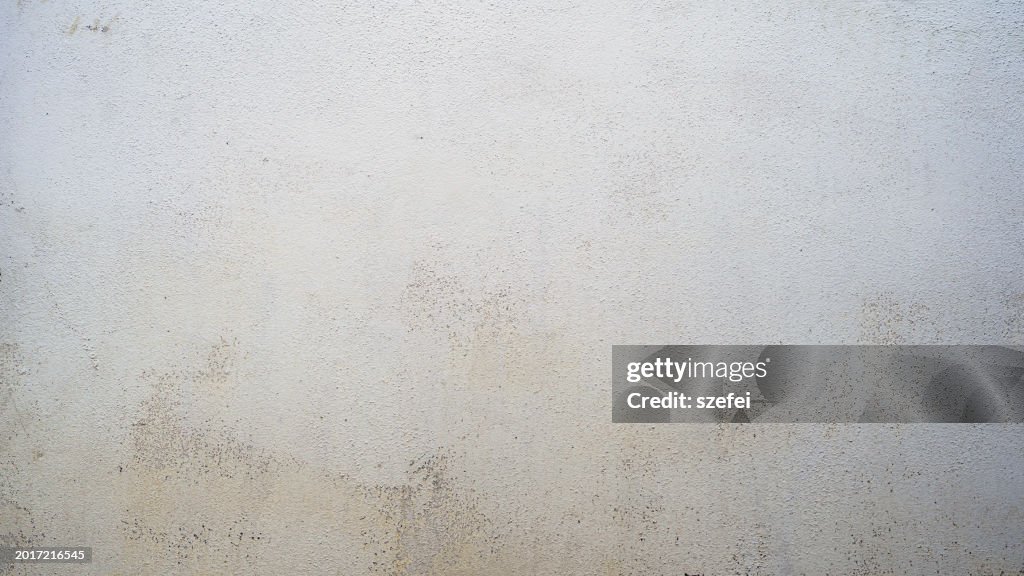 Grunge concrete wall background in beige color