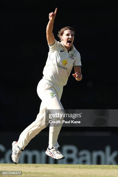 Annabel Sutherland of Australia celebrates taking the wicket of Chloe Tryon of South Africa during day three of the Women's Test Match between...