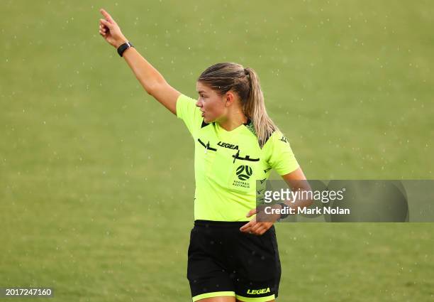 Referee Isabella Mossin calls a halt to play for a second time as a thunderstorm interrupts play during the A-League Women round 17 match between...