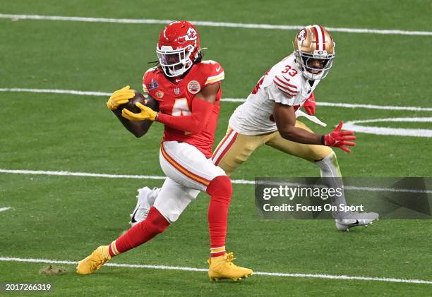 Rashee Rice of the Kansas City Chiefs catches a pass in front of Logan Ryan of the San Francisco 49ers during Super Bowl LVIII at Allegiant Stadium...