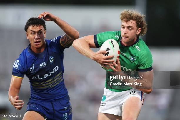 Jed Stuart of the Raiders takes on the defence during the NRL Pre-season challenge match between Parramatta Eels and Canberra Raiders at Netstrata...