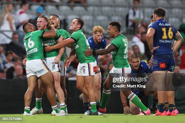 Noah Martin of the Raiders celebrates with team mates after scoring a try during the NRL Pre-season challenge match between Parramatta Eels and...