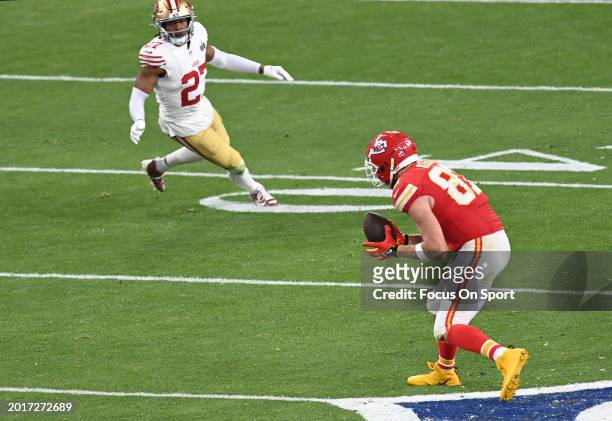 Travis Kelce of the Kansas City Chiefs catches a pass against the San Francisco 49ers in overtime during Super Bowl LVIII at Allegiant Stadium on...