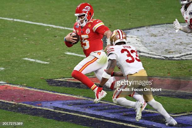 Patrick Mahomes of the Kansas City Chiefs scrambling with the ball is pursued by Logan Ryan and Fred Warner of the San Francisco 49ers in overtime...