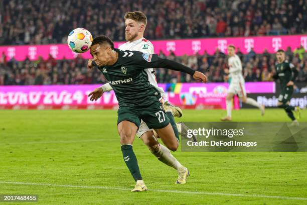 Felix Agu of SV Werder Bremen and Jan Thielmann of 1. FC Köln battle for the ball during the Bundesliga match between 1. FC Köln and SV Werder Bremen...