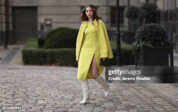 Anna Hiltrop seen wearing Escada yellow / lime green zip midi dress, matching Escada yellow / lime green wool short coat / bomber jacket, Valentino...